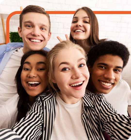 five happy youth posing for a group photo