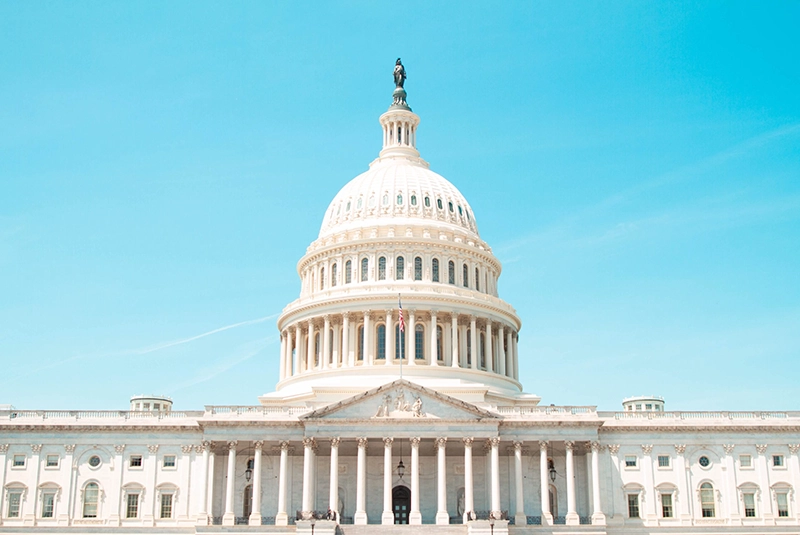 The US Capitol Building against a blue sky