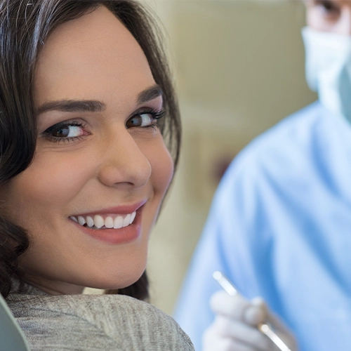 woman smiling in the dentist chair