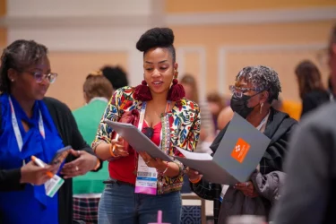 women talking at NatCon