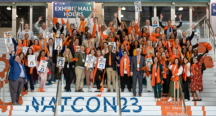 more than 50 National Council staff members pose on the steps during NatCon23