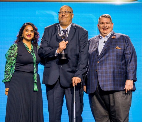 anthony kohel receives an award of excellence at NatCon25