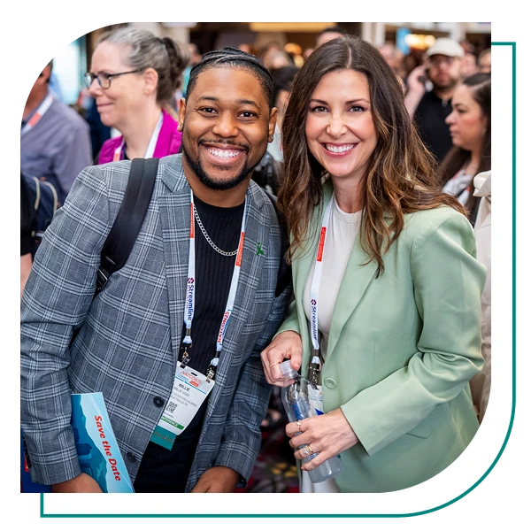 two natcon attendees smiling