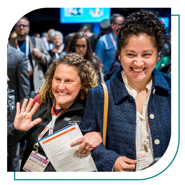 natcon attendees smile while networking with fellow mental health professionals