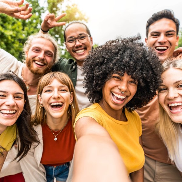 group of happy young people celebrate national recovery month
