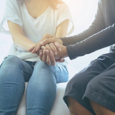 women-holding-hands-compassion-care