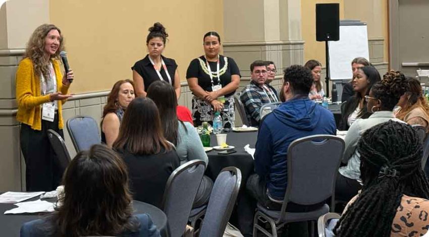 a group of adults in a classroom