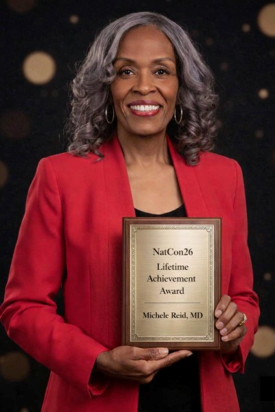 dr. michelle reid poses with her lifetime achievement award