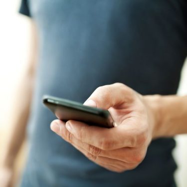 gambling-addiction-man-on-phone
