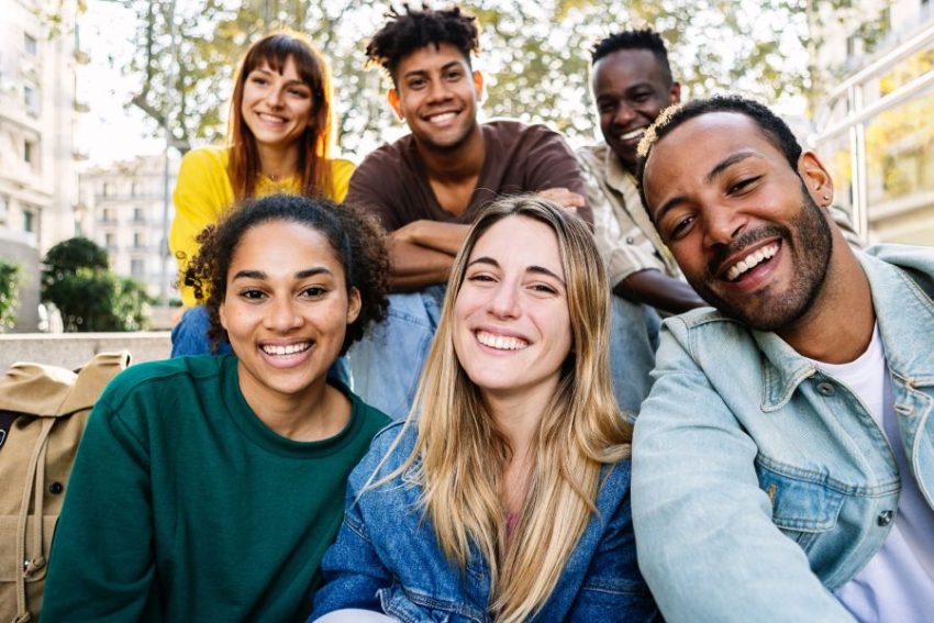 happy group of people smiling at the camera