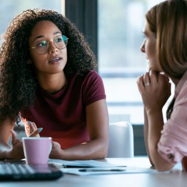 two-young-women-talking